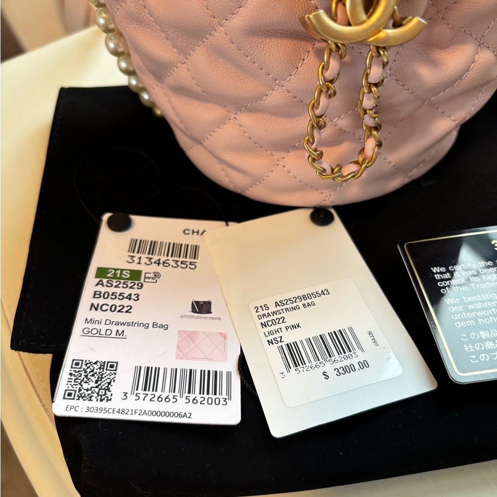CHANEL Light Pink Quilted Mini Drawstring Bag with Pearl Chain. Never Used. - Picture 10 of 16